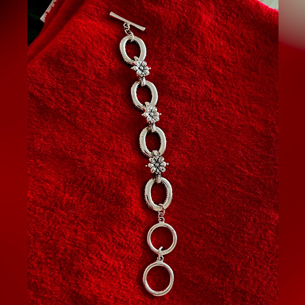 Silvertone bracelet with flower accents